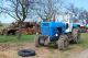 24 smutný modrý traktor